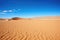 sandy dunes in namib desert under a clear sky