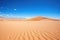 sandy dunes in namib desert under a clear sky