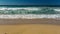 Sandy gold coast beach with waves, Australia