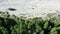 Sandy, gravelly riverbed on the edge of the German Alps, dried up by the drought of climate change, aerial photo