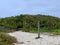 Sandy Hiking Trail Leading Into Green Thicket