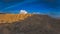 Sandy hills. Sandy canyon. Warm colors background. Yellow sandstone textured mountain, white thin sand dune, bright sky.