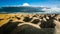 Sandy hills. Sandy canyon. Warm colors background. Yellow sandstone textured mountain, white thin sand dune, bright sky.