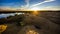 Sandy hills on the sunset. Lake in the Sandy canyon. Warm colors background. Yellow sandstone textured mountain, white thin sand d