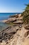 Sandy little beach with big rocks at Seccheto, Elba Island, Italy