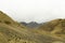 A sandy mountain hills with snow rocks