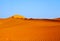 Sandy orange dune under blue clear sky in the Namib desert Naukluft Park Sossusvlei, Namibia, South Africa