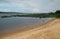 Sandy river bank. Landscape overlooking the river. River beach