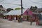 Sandy road with tourists and stalls on Holbox Island, Quintana Roo, Mexico located in north yucatan peninsula