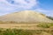 Sandy-rocky hill in the steppe. Snake Mountain, natural landmark