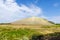 Sandy-rocky hill in the steppe. Snake Mountain, natural landmark