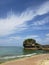 Sandy and Rocky shorline in Okinawa Japan with white puffy clouds