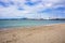 Sandy San Francisco beach looking out across the bay towards docked museum ships