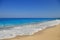 Sandy seashore with blue sky