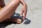 Sandy Serenity: Close-Up of Yellow Pedicured Feet and Relaxation at the Beach