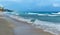 Sandy shore, beach and turquoise sea, big waves, Caribbean, CancÃºn, Mexico