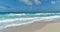 Sandy shore, beach and turquoise sea, big waves, Caribbean, CancÃºn, Mexico