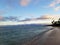 Sandy shoreline of Hunakai Beach in Kahala at dusk