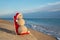 Sandy snowman sunbathing in beach lounge. Holiday concept for Ne