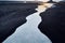 Sandy strip of iceland beach shore in dark gray tones