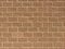 sandy tan solid block brick wall dusk warehouse factory alley building brown facade