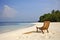 sandy tropical beach paradise, soaking up the warm summer sun, Palm trees, comfortable beach chair