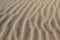 Sandy waves - Vertical sand texture build and created by the wind and ocean