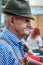 SANFORD, FLORIDA - OCT 14, 2019 - German Festival. A senior man dressed in traditional outfit enjoys the beer festival