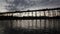 SANGKHLABURI, THAILAND - DECEMBER 27, 2015: Traveler crowd walking on Sapan Mon Bridge, wooden bridge across the river in morning