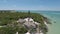 Sanibel Island Light House close up then fly back to show Sanibel island