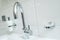 Sanitary with with chromium faucet and white bathroom