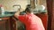 Sanitary engineering repair of water leakage. man fixing a faucet in the kitchen