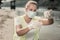 Sanitary inspector wearing gloves and mask holding test tubes with river water