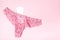Sanitary napkin with underwear on a pink background, health care, monthly protection, reliable friend