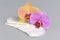 Sanitary towels with orchid flowers on gray