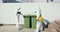 Sanitation doctors disinfect trash bins, garbage containers. Sanitation