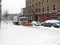 Sanitation truck shoves snow off Bronx street in NY