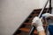 Sanitation worker disinfecting the banister of a staircase with spray for Covid-19 prevention