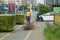 Sanitation worker dragged a bundle of dry wood