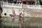 Sanitation workers in the river clean up garbage