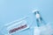 Sanitizer gel or antibacterial soap and face mask for coronavirus preventive measure, top view. Corona virus concept