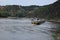 Sankt Goarshausen, Germany - 08 04 2022: Cargo ship on a close pass in Loreley narrows, passing part