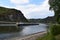 Sankt Goarshausen, Germany - 08 04 2022: Cargo ship on a close pass in Loreley narrows, ting