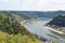 Sankt Goarshausen, Germany - 08 04 2022: Loreley passage during drought with Burg Katz and cargos ships in the passage