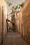 Sanliurfa old city, Turkey, typical narrow street, white stone buildings