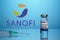 Sanofi Logo with Inoculation Syringe and Covid Vaccine Vial