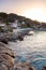 Sant Andrea, Elba Island, Italy - 04 June 2022 Tourists relaxing at white sandy beach at sunset