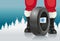 Santa and automobile tires. Santa offers automobile tires with winter marking for Christmas.