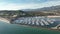 Santa Barbara California Harbor pier, aerial drone. Flying near ocean in Santa Barbara, CA. Yachts and Boats. Pier, port