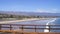 SANTA BARBARA, CALIFORNIA, USA - OCT 8th, 2014: View of palm trees on the shore and mountains from Stearn`s Wharf